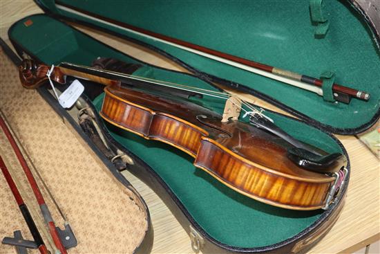 A German Strad style violin and a small violin and two bows